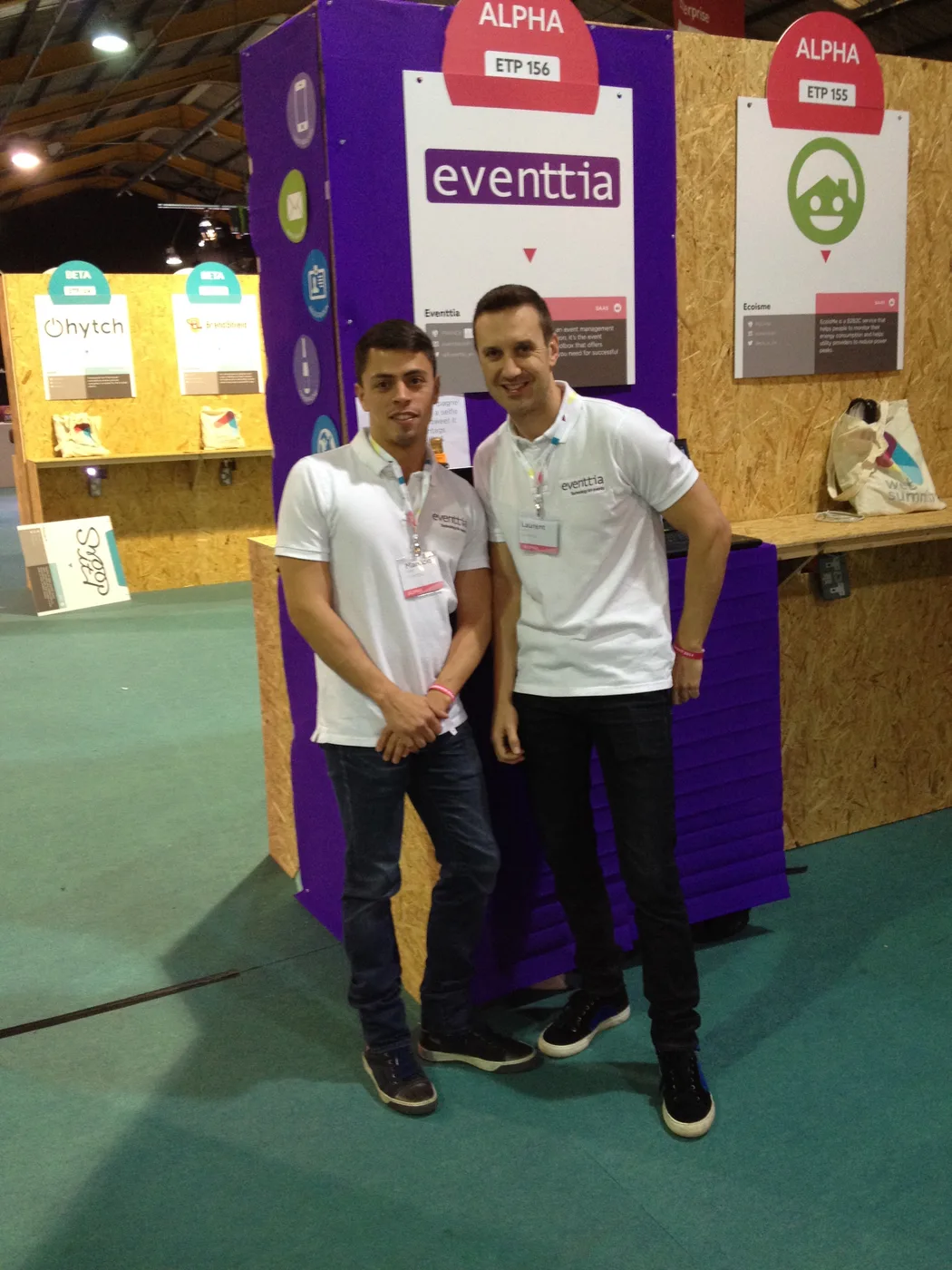 Mauricio and Laurent in white eventtia polos in front of an early eventtia booth at Web Summit Dublin 2014, with the 'ALPHA ETP 156' early-stage startup sign visible above.