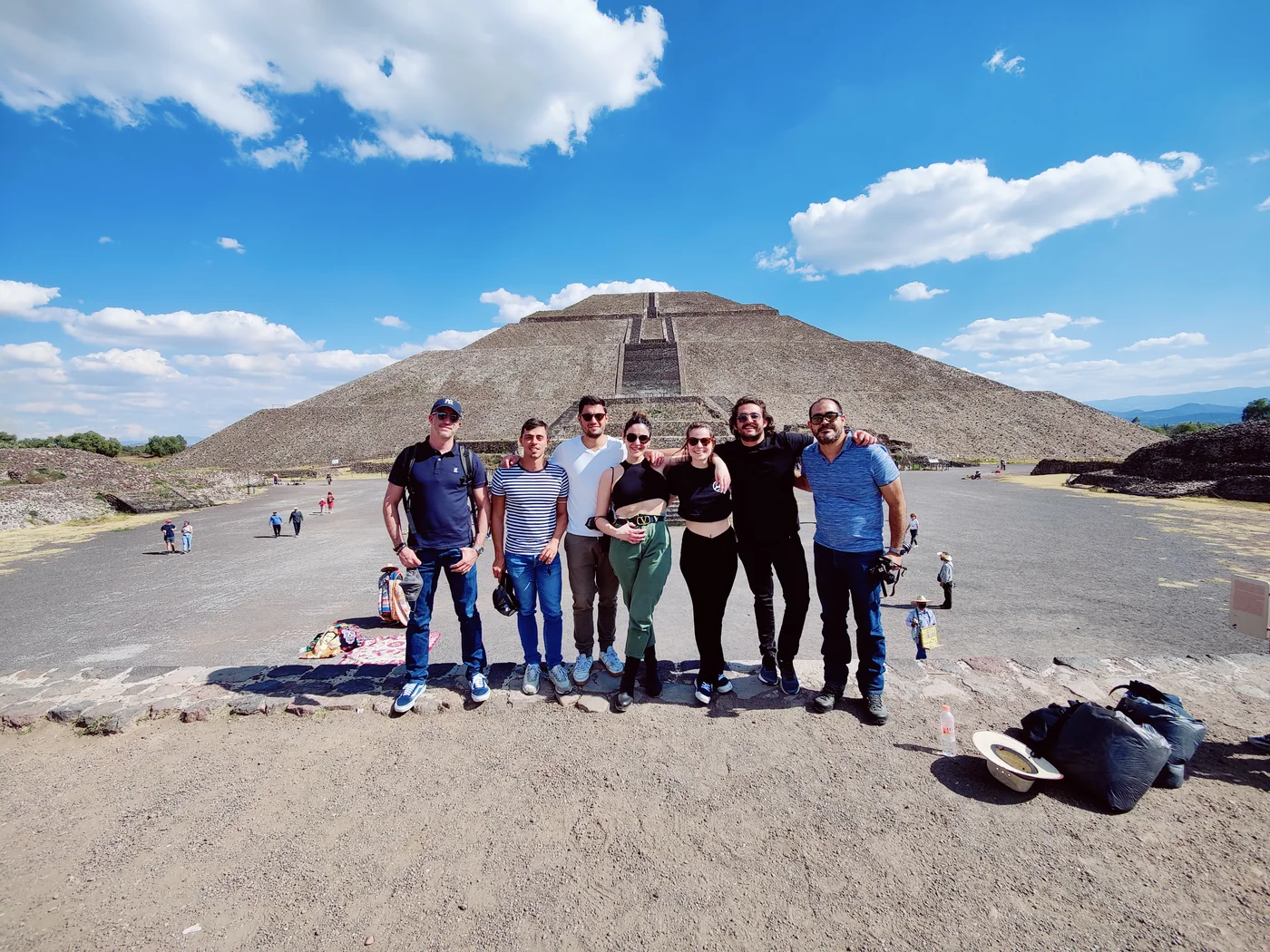 Six Eventtia team members in front of the Pyramid of the Sun at Teotihuac&aacute;n, Mexico, January 2022.